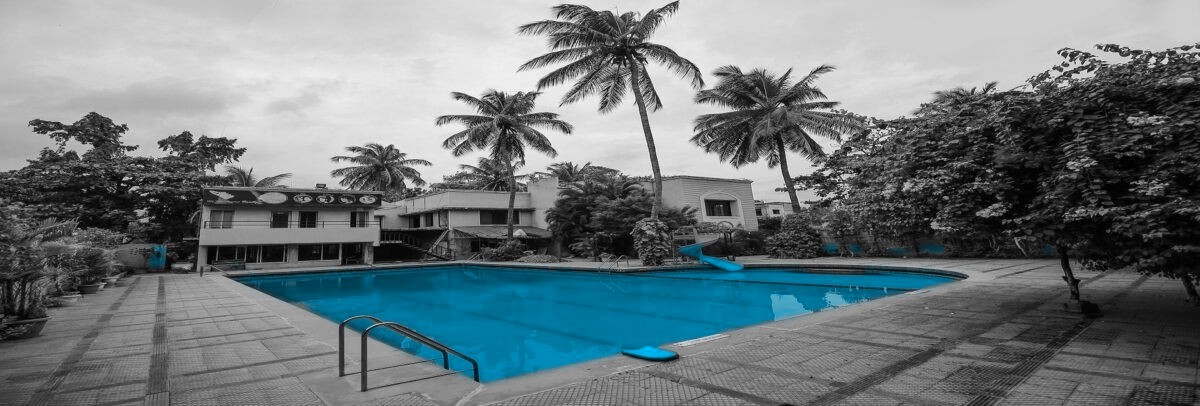 The open-air swimming pool at Hotel Sangam, Karad, under an evening sky