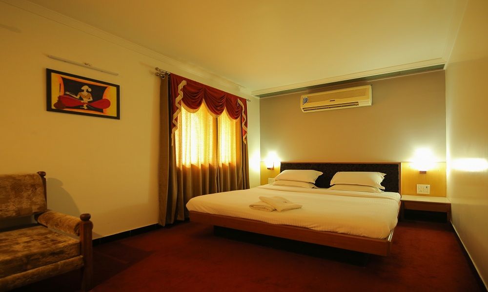 Suite at Hotel Sangam Karad with a separate sitting area